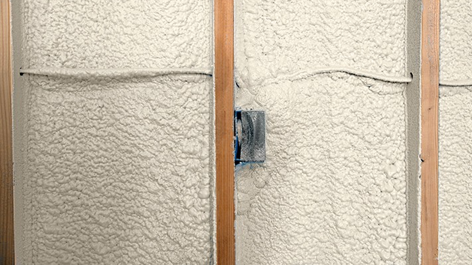 Spray foam insulation installed in open wall cavities